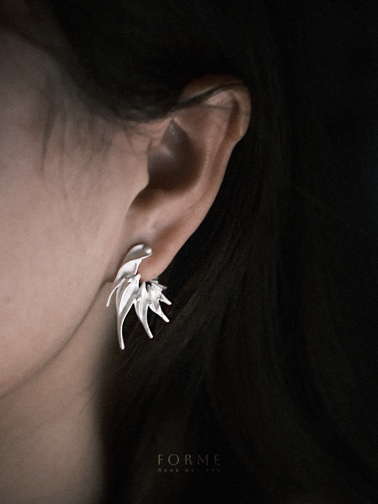 Organic drop earrings with flame-inspired design