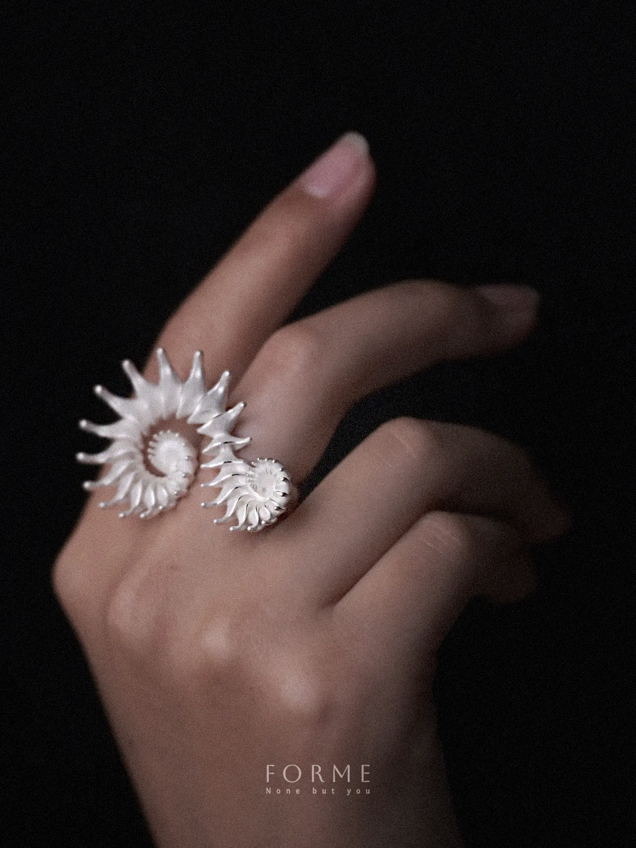 Custom silver ring with dual spiral design