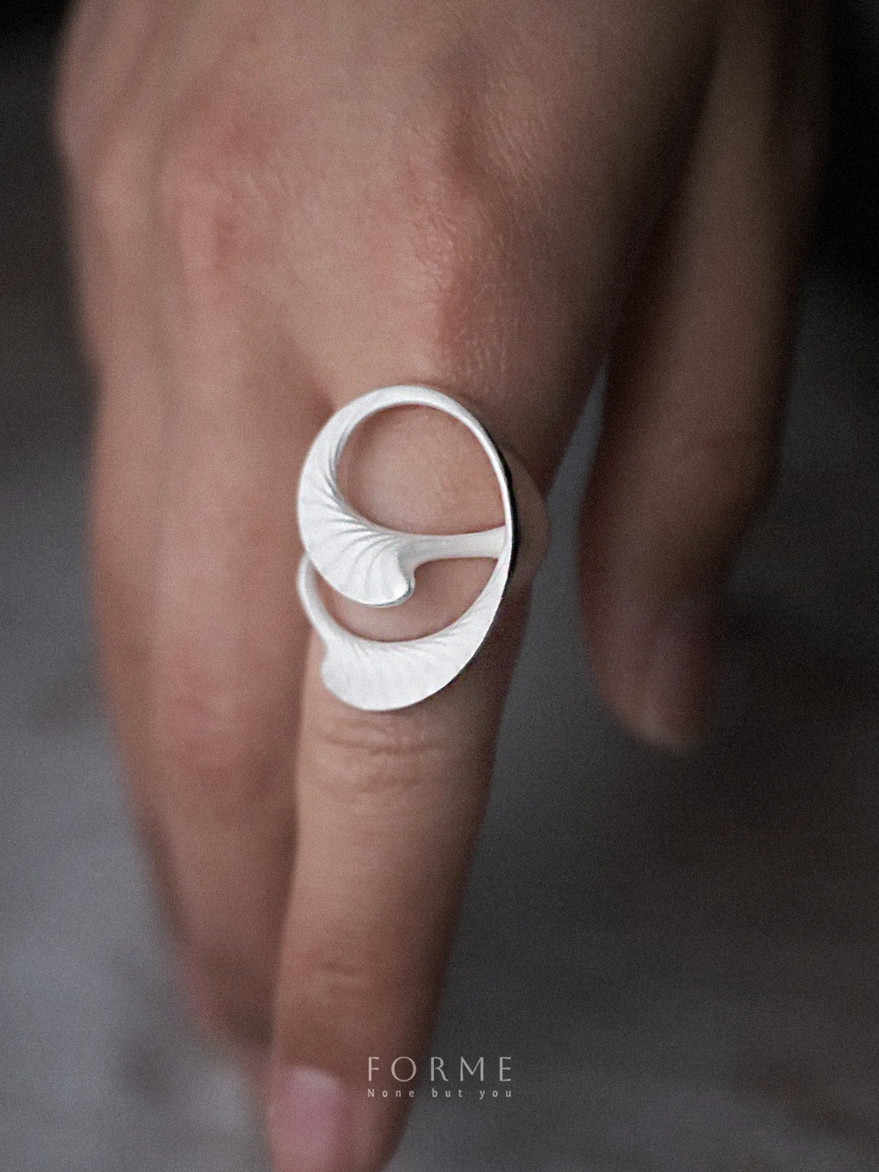 Handmade silver ring with flowing life-inspired curves